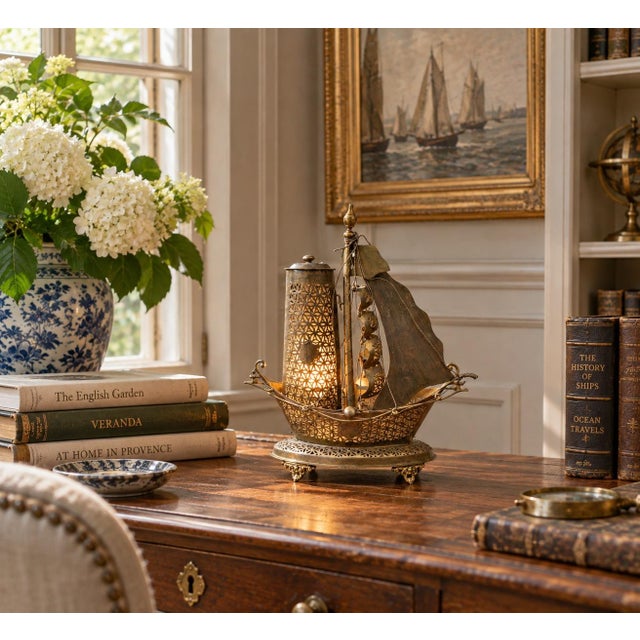 An unusual and beautifully detailed mid-20th century German brass sailing ship nightlight that effortlessly bridges...
