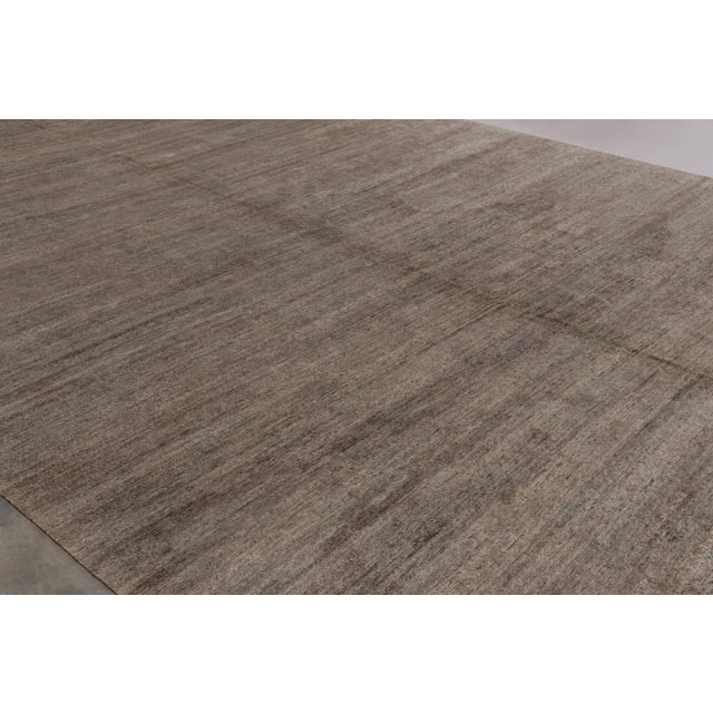 Hand-knotted in a luxurious blend of wool and silk, this monumental 13x20 rug is a rich new addition to Rug & Kilim’s...