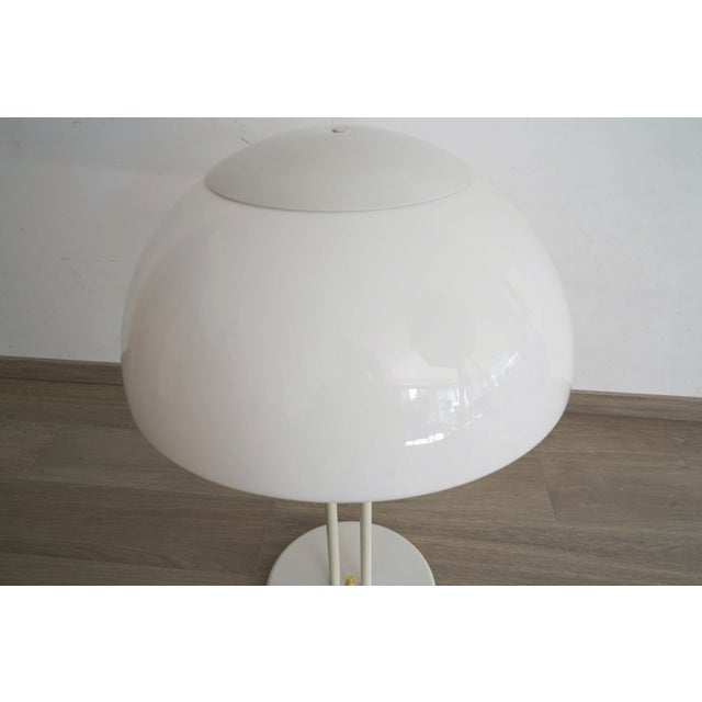 Vintage white table light. The light comes with a white coated plastic shade on a white coated metal frame and base....