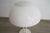 Vintage white table light. The light comes with a white coated plastic shade on a white coated metal frame and base....