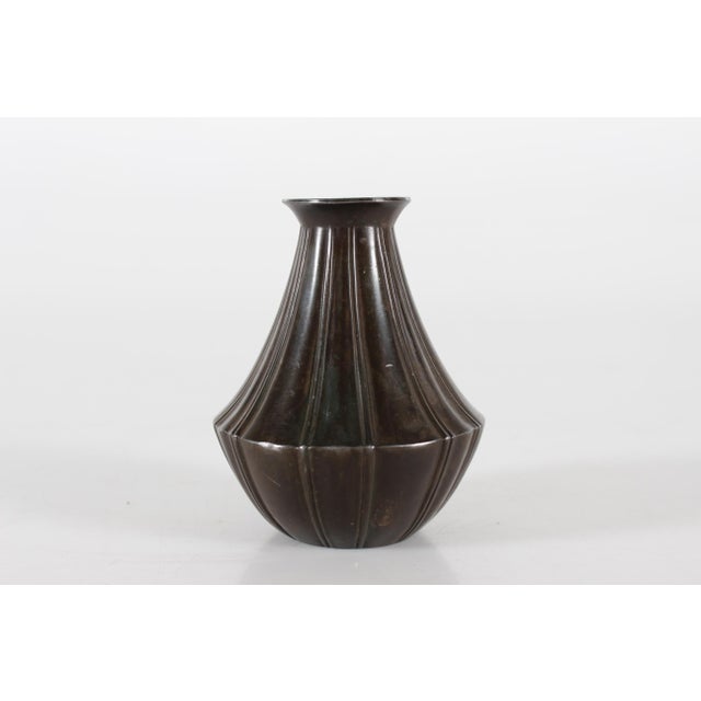 Decorative Art Deco vase made of disco metal with brown patina. It's designed and made by the Danish artist Just Andersen...