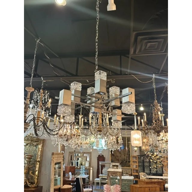 Interesting French MCM nickle and and glass 8 light suspension chandelier. Very fine quality and perfect for a modern...