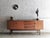 This sideboard, in typical minimalist mid-century style, was crafted in the 1960s. high-quality craftsmanship in a simple,...