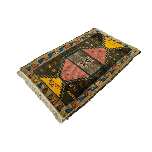 Vintage Handknotted decorative mini rug from Kars region of Turkey. Approximately 45-55 years old. In very good condition.