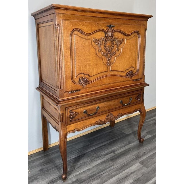 This elegant Vintage French Louis cabinet is a beautifully proportioned and decorative piece, showcasing refined oak...