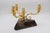 An Aldo Tura Modernist three-arm candelabrum. Patinated brass arms with wooden base covered in lacquered parchment.
