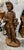 Statue of a young man hand carved from a solid piece of wood. Typically referred to as "Figure of Autumn" or a young man...