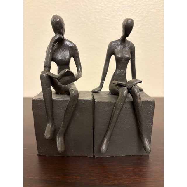 These 1970's iron bookends statuesque style are impressive in that they show depth details of each character specifically...