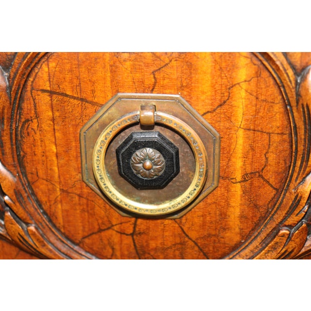 This exceptionally elaborate English paint-decorated demi-lune sideboard, in the Adam taste, is a striking expression of...
