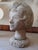 Mid Century life sized concrete bust of a young woman, illegibly signed. Bust sits atop a metal pronged base (see photos)....