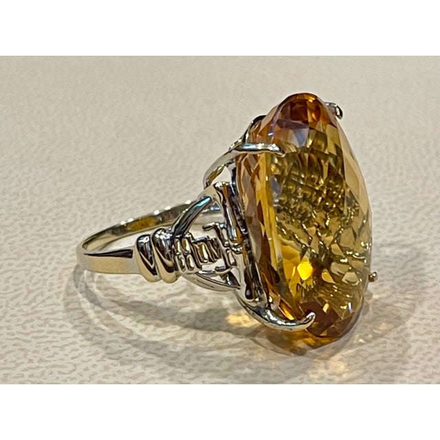 Exact 34.41 Carat Natural Long Oval Checkerboard Citrine Cocktail Ring in 14 Karat Yellow Gold, Estate This is a ring...