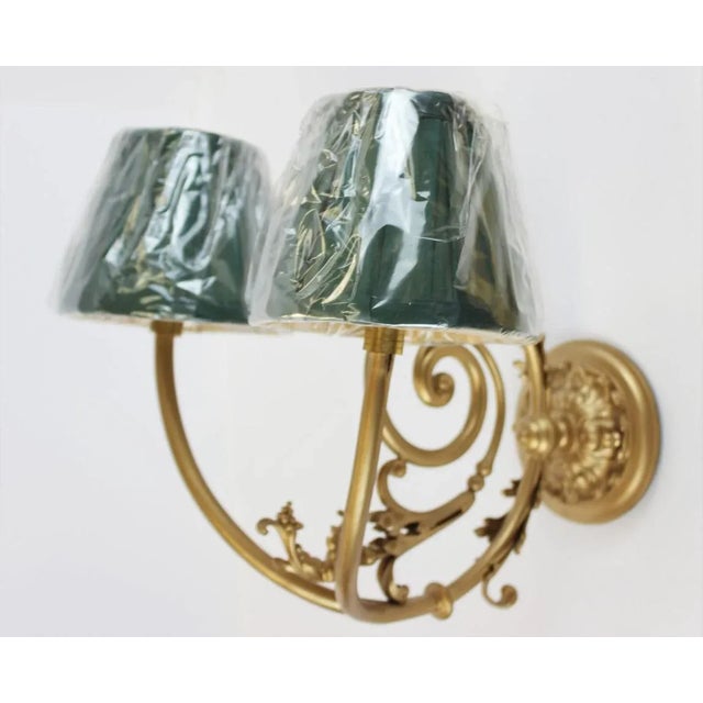 Ornate Gilt Wall 2 Socket Sconce w/ 2 Green Shades. Freshly Rewired w/ New Pleated (4"H) Shades. Dimensions: 10"D x 8"H