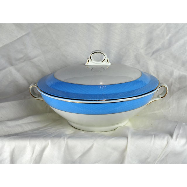 Large white soup tureen with textured pastel blue friezes. This iconic soup tureen from the 50s is pleasant with its...