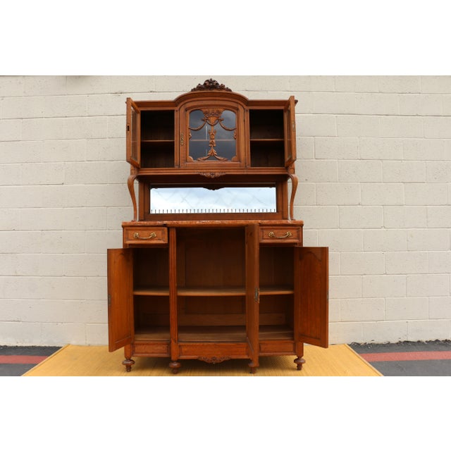 Wonderful Antique French buffet/hutch made of solid oak wood with marble top. The base has two drawers and three doors...