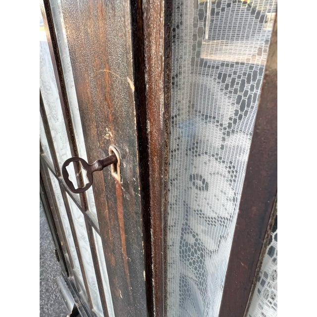 Antique Dark wood cabinet. The shelves can be adjusted easily. Easily moves around the room on Wooden Wheels. This petite...