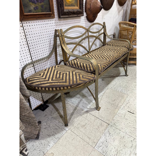 A distinctive antique French iron bench composed of three individual sections that connect together to form one long...