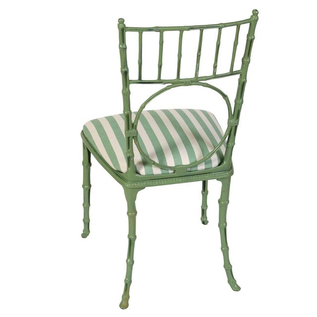 A pair of charming metal chairs from France, feature a faux bamboo motif on a fresh green painted finish. Their unique...