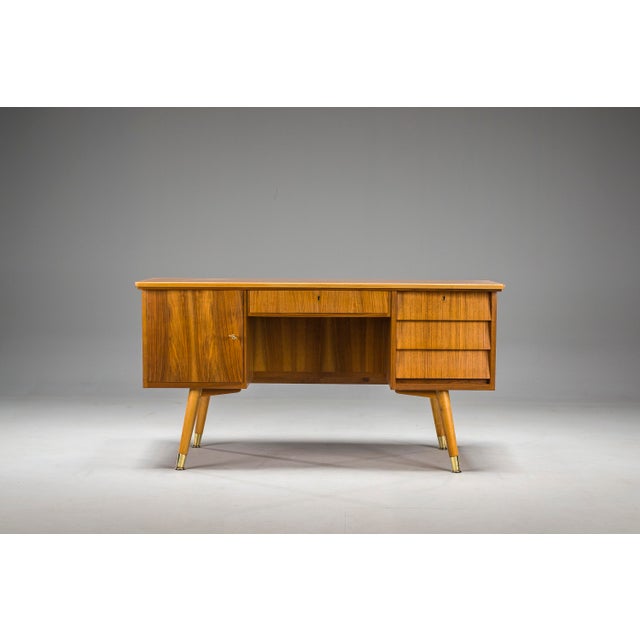 This desk with a semi-arched top is a stunning addition to any home office. The spectacular brass leg fittings add a touch...