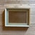 Professional vintage art frame. Wooden frame featuring a soft neutral painted finish, silver-toned outer border, pale blue...