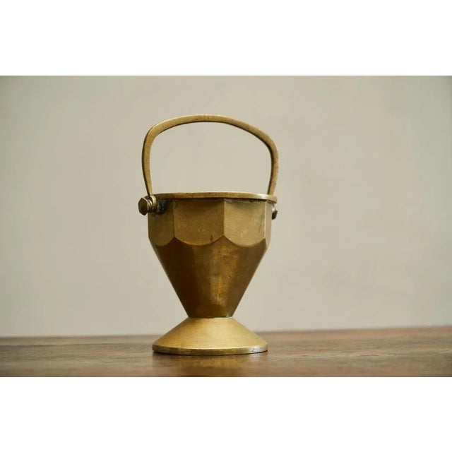 Eared Art Deco Basket in Patinated Solid Brass Early 20th Century. Wonderful and very distinct basket / bowl / vase in...