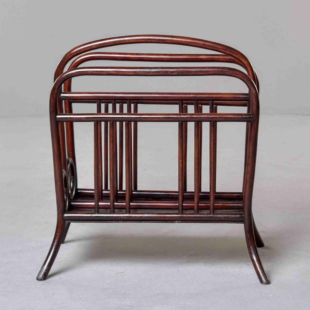 A charming bentwood magazine rack by Thonet, Vienna, circa 1900–1910. Steam-bent beechwood in original dark walnut stain...