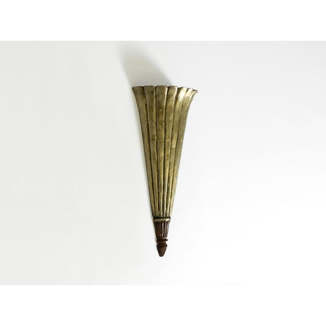 Beautiful, long, triangular wall lamp from the 1950s, made of wood. Great design with many lovely details. Covered on the...