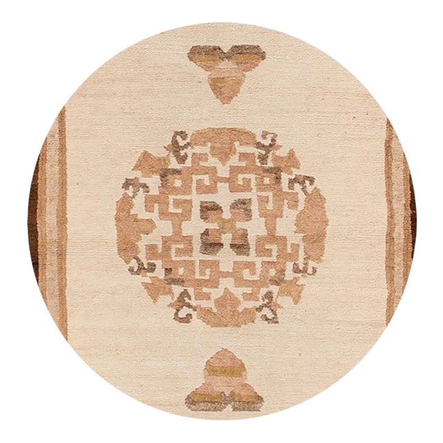 A hand-knotted antique Chinese rug with a medallion design. This piece has great detailing and colors. It would be the...