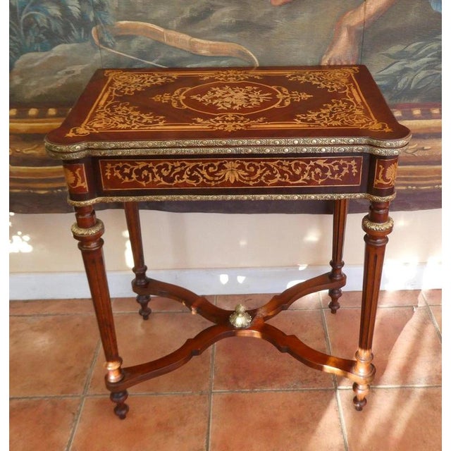 French louis xvi style walnut and mahogany games table, circa 1920–1930 material: walnut, mahogany, brass and leather a...