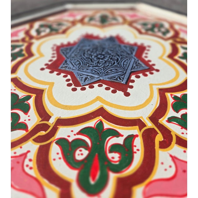 Bring vibrant Moroccan charm to your home with this beautifully handcrafted and hand-painted accent table. Featuring a...