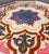 Bring vibrant Moroccan charm to your home with this beautifully handcrafted and hand-painted accent table. Featuring a...