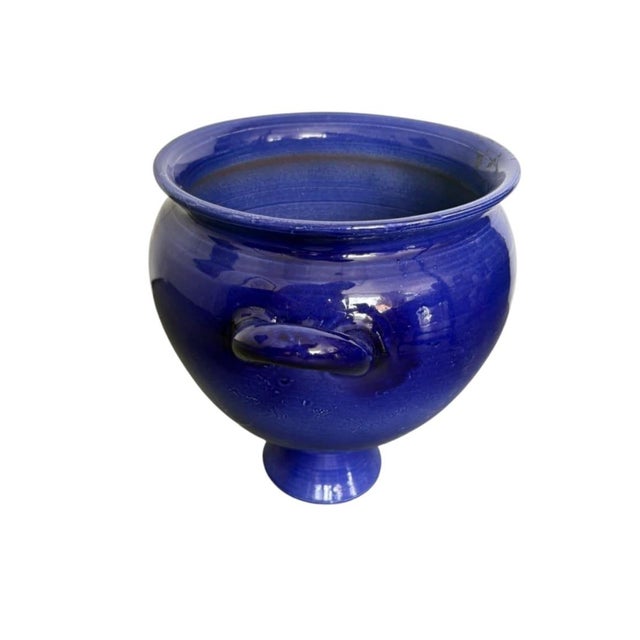 Boasting a rich, deep cobalt blue glaze and classic proportions, this striking vintage ceramic urn vase makes an...