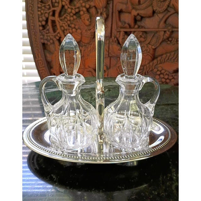 Beautiful, 1940's antique French crystal and genuine plated silver cruet serving set. This timeless French treasure...