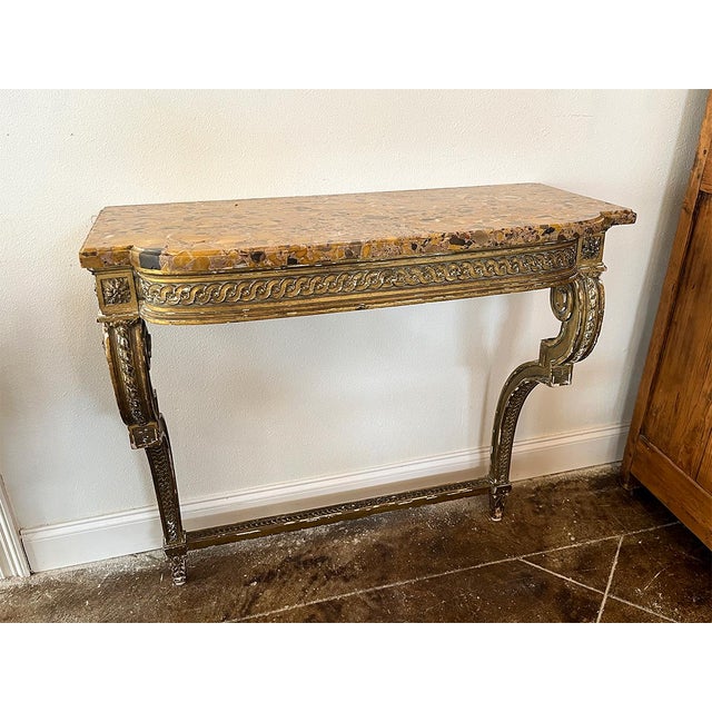 This console is made of marble and giltwood. It is installed on a wall to give a floating appearance. Once installed, the...