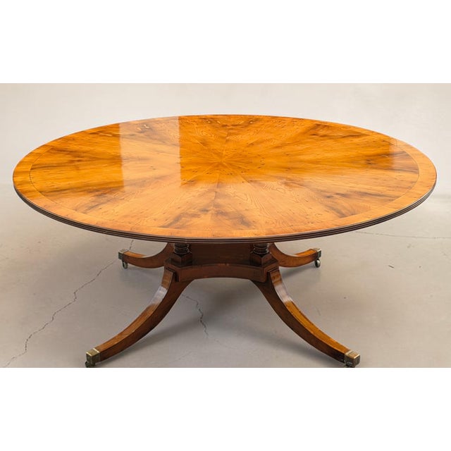Wood English Regency Revival 72-Inch Figured Elm Sunburst Center Pedestal Dining Table on Brass Casters For Sale - Image 7 of 18