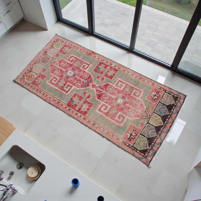Welcome to our curated collection of authentic Anatolian textiles. This stunning small rug is a genuine hand-knotted piece...