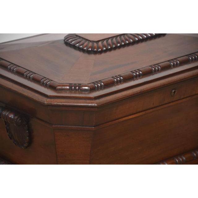This impressive early 19th-century mahogany cellarette is crafted in the refined sarcophagus form associated with the late...