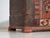 Tyrolean polychrome pine trunk with geometric panels in cream, red and black on a dark ground, dated 1906. A folk piece...