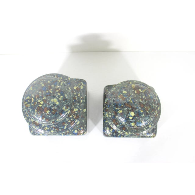 Beautiful pair of very heavy lidded ceramic kitchen canisters. These have a mid century drip or speckled glaze on the...