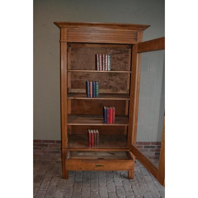 20th-century Dutch oak bookcase, display cabinet, shop cabinet, china cabinet, or library cabinet. The height is 198 cm....