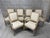 Timeless and elegant set of 6 French Louis XVI bergere style arm chairs upholstered in a neutral textured plaid that...