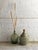 This green glass demijohn/wine carboy in a gray plastic basket was manufactured in Italy in the 1960s and imported to...