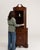 A refined Georgian corner vitrine crafted in rich mahogany, designed to maximize space while providing elegant display...