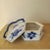 Sweet blue and white porcelain box with blue handle. The edges are scalloped. A great touch to any vanity top, console or...