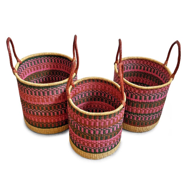 Handwoven seagrass authentic Bolga laundry or storage baskets. Each has sturdy leather wrapped handles for easy carrying....