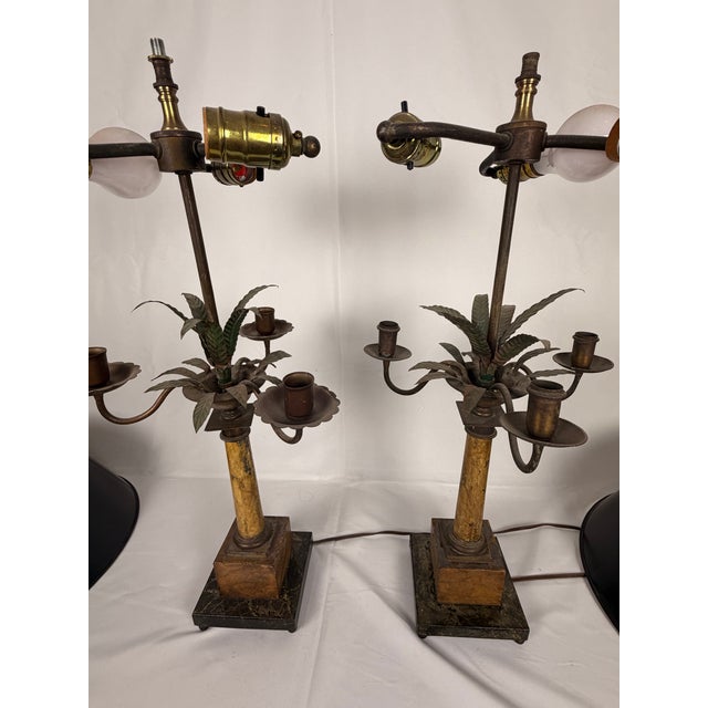 A striking pair of mid-century Italian Hollywood Regency-style table lamps, designed as stylized palm trees with hand-...