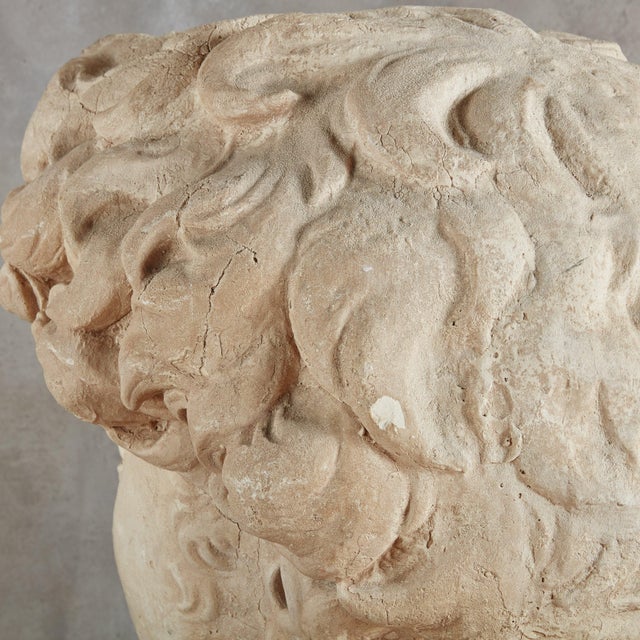 A monumental Italian bust of David sculpture designed by Stone International in 1992. Crafted from metal with a plaster...