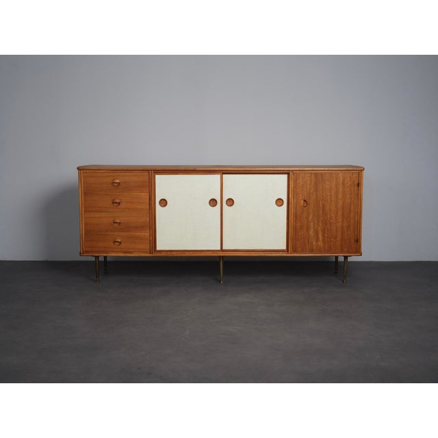 An elegant mid-century modern sideboard designed by william watting for fristho in the netherlands during the 1950s. The...