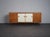 An elegant mid-century modern sideboard designed by william watting for fristho in the netherlands during the 1950s. The...