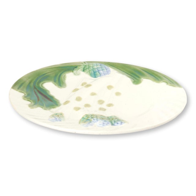 Set of six French majolica asparagus and artichoke plates featuring softly modeled asparagus spears, artichoke blooms and...
