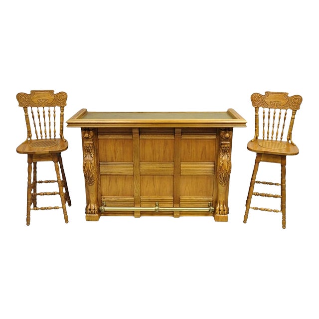Late 20th Century Pulaski Keepsake Collection Oak Wood Bar With Griffins and 2 Swivel Bar Stools - Set of 3 For Sale